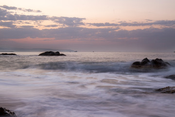 Naklejka premium cliffs and sunset view on the beach