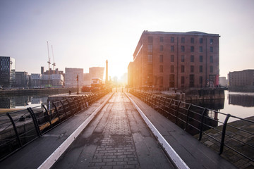 The Albert Dock area of Liverpool just after sunrise, with low sun and long shadows