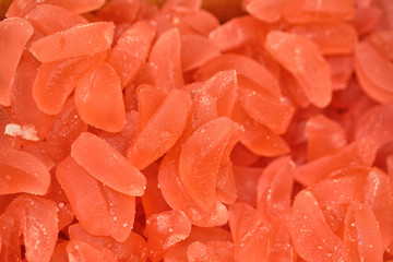 Background and texture of red marmalade sweets.