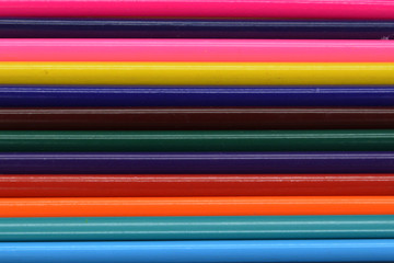 background of colored wooden pencils