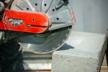 Fragment of a joint cutter on a brushed concrete surface.
