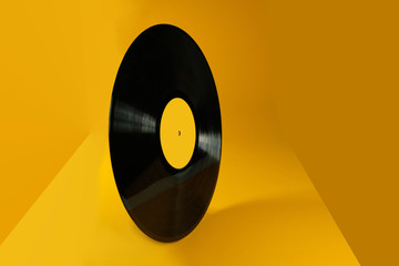 Vinyl record on an abstract yellow background. Old vintage vinyl record. - 328943375