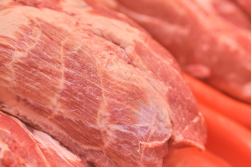 A piece of raw meat on the counter.