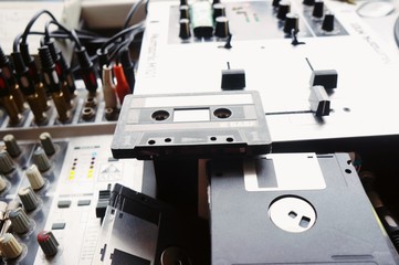 vintage hip hop recording studio, different consoles and controllers, old sound media