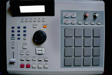 vintage drum machine with pads making hip hop instrumental