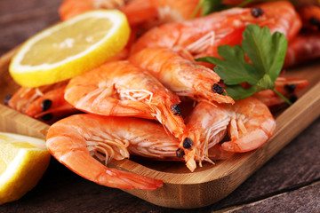 Raw fresh Prawns Langostino Austral. shrimp seafood with lemon and spices on background