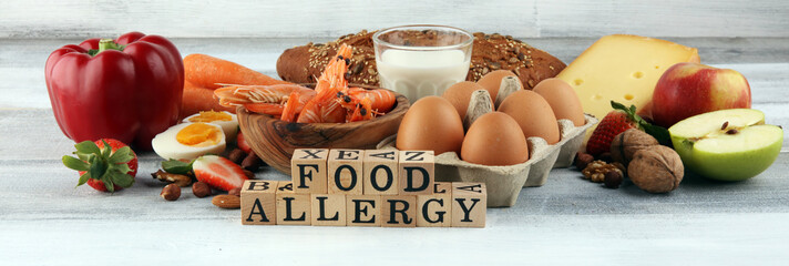Allergy food concept. Allergy food as almonds, milk, cheese, strawberry, seeds, eggs, peanuts and...
