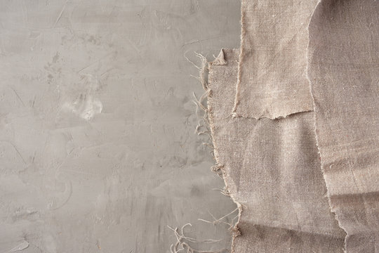 Very Old Gray Vintage Kitchen Towel On Gray Cement Background