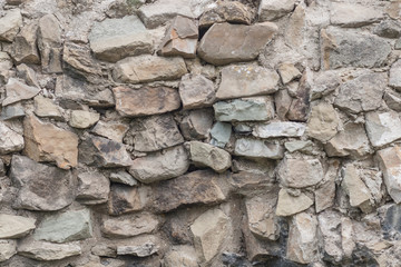 natural texture background of an old wall. old medieval masonry