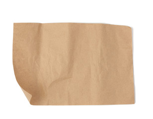 piece of brown parchment paper with torn edges isolated on a white background