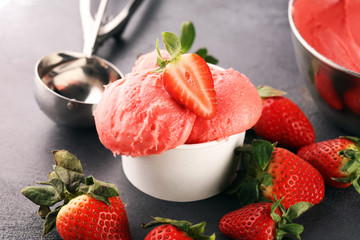 Strawberry ice cream scoop with fresh strawberries and icecream