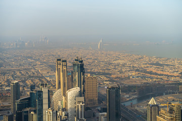 Aerial panoramic view of Dubai downtown skyline with skyscrapers in morning dust, United Arab Emirates.