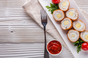 Scotch egg meat balls on rustic wooden background