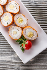 Scotch egg meat balls on rustic wooden background