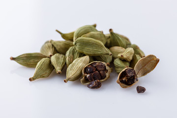 fragrant green cardamom on a white acrylic background