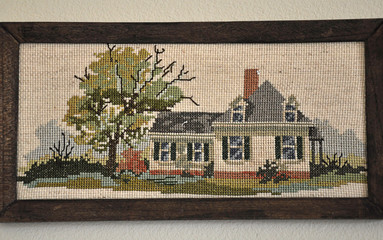 Cross stitched old house in frame - obrazy, fototapety, plakaty