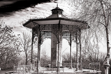 Old abandoned gazebo before the approach of the storm