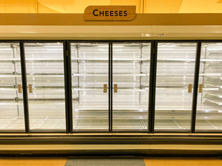 Cheese Section Of Local Grocery Store With Empty Shelves