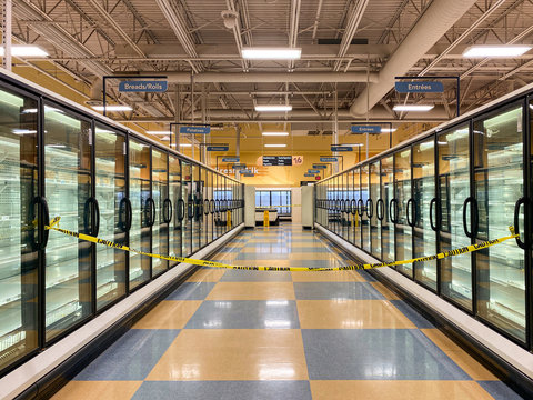 Empty Grocery Store Freezer Aisle With Caution Tape Blocking Entrance