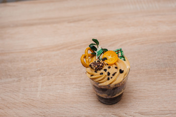 A beautiful and mouth-watering close-up trifle on a table with space for a signature. Cake