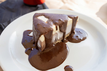 Frozen ice cream with chocolate sauce