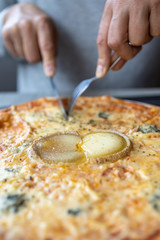 Delicious cheese pizza close-up in restaurant