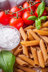 concept of traditional italian pasta with tomatoes and basil