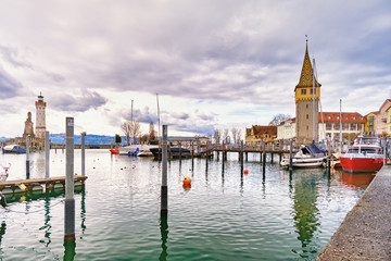 Naklejka premium Small port with a tower and boats