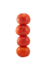 column of red tomatoes on a white background