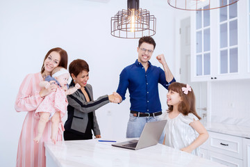 Fototapeta premium Joyful family and the Asian senior businesswoman