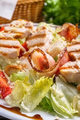 Caesar salad on dark wooden rustic background