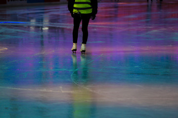 Nice colorful ice rink in vienna with the scooters of a maintenance person in the background.