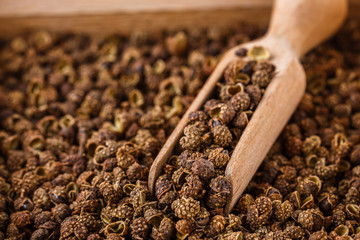 fragrant Sichuan pepper on white acrylic background