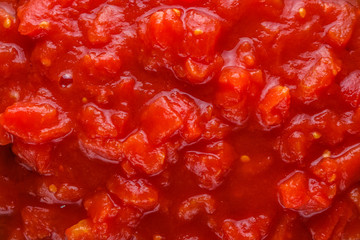 juicy canned tomatoes on wooden rustic background