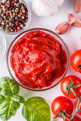 fresh natural tomato paste on a white background