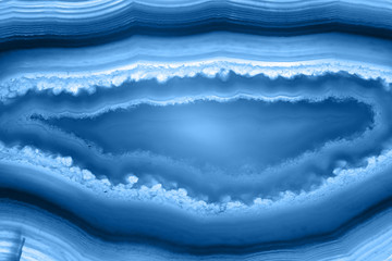 Obraz premium Abstract background - striped agate slice mineral, color of the year 2020 pantone classic blue 19-4052