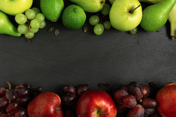 fruits background green and red color set, dark stone slake plate with copy space. Flat lay top view. Summer abstract creative trendy fresh concept.