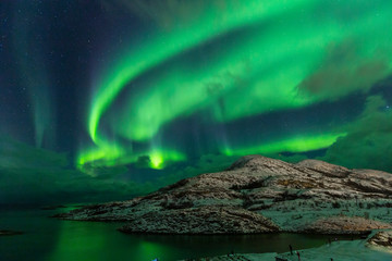 Northern lights on the arctic sky. Hillesoya, Sommaroya.