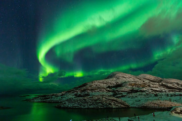 Northern lights on the arctic sky. Hillesoya, Sommaroya.