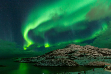 Obraz na płótnie Canvas Northern lights on the arctic sky. Hillesoya, Sommaroya.