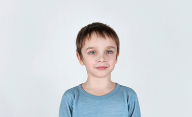 Little boy grining/smile. Cute child on a light background.