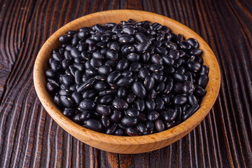Fresh organic natural beans on wooden rustic background