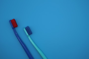 Tooth brushes on blue background