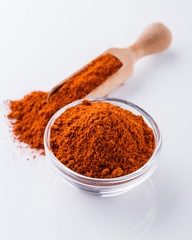 aromatic spicy chili powder on a white background