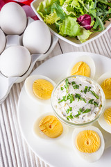 boiled chicken eggs on a white wooden rustic background