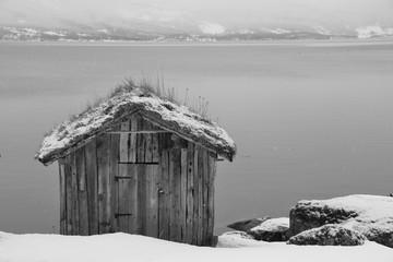 Lone hut in a fjord