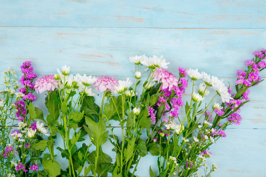 Colorful gebera flower on wooden background