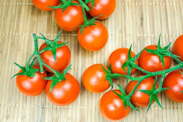 Background of ripe cherry tomatoes on the table