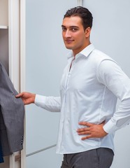 Businessman dressing up for work