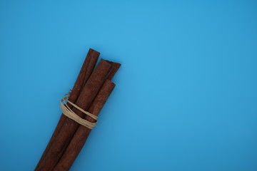 cinnamon sticks on blue background